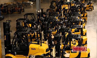 Briggs heavy equipment parked in an interior showroom.