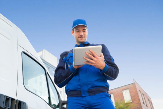 Delivery man using ipad