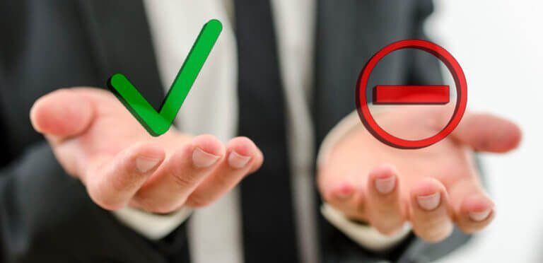 Check mark and minus in hands software decision drivers consultants erp vendor long list