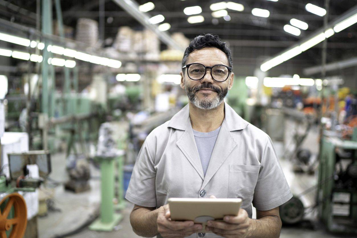 Warehouse worker looking at camera