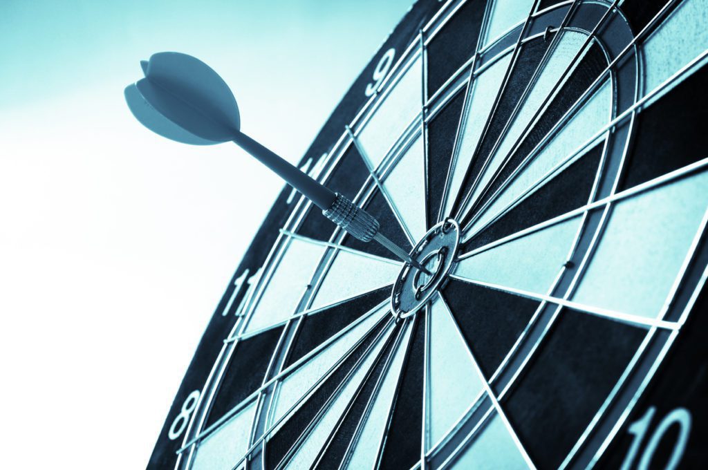 Black dart in center of dart board