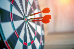 Red darts in center of dart board